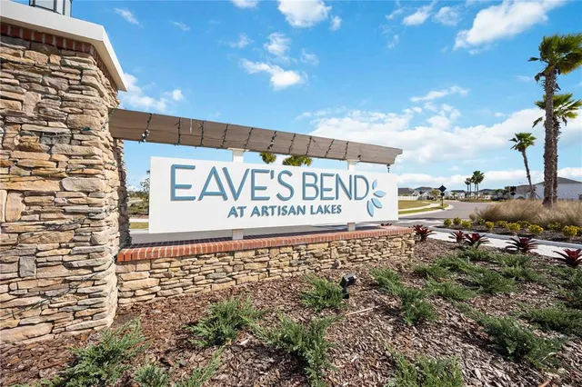 a sign broad in front of the house