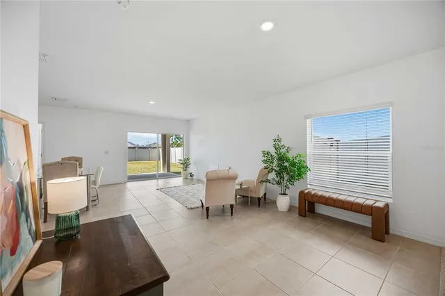 a living room with furniture and a window