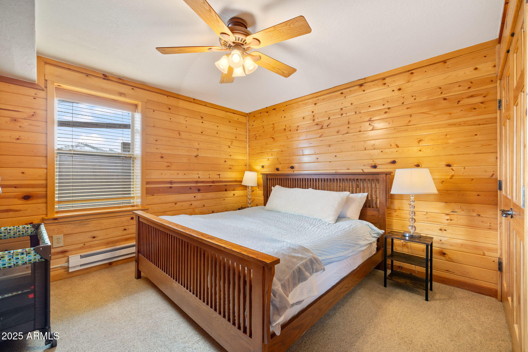 100 Main Street Greer, AZ 85927 - Photo 44 of 63 a bed sitting in a bedroom next to a window