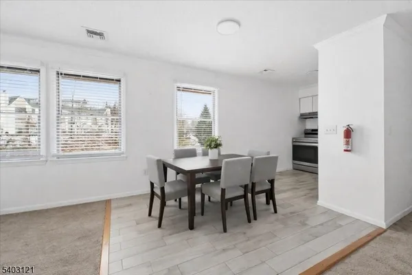 a dining room with furniture and window