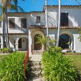 a front view of a house with garden