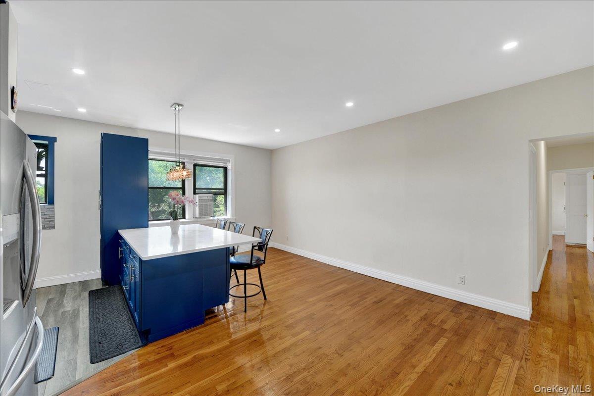 4784 Boston Post Road, Unit B43 Pelham, NY 10803 - Photo 5 of 22 a view of kitchen and hall with wooden floor