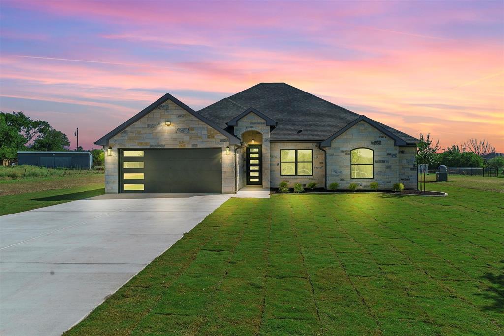 607 Reynolds Road Godley, TX 76044 - Photo 1 of 1 a front view of a house with a yard