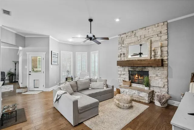 a living room with furniture and a fireplace