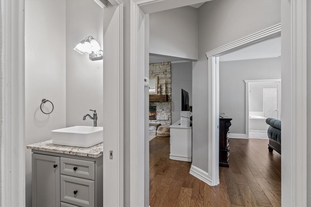 1807 Mill Creek Road Canton, TX 75103 - Photo 15 of 33 a bathroom with a sink and a mirror