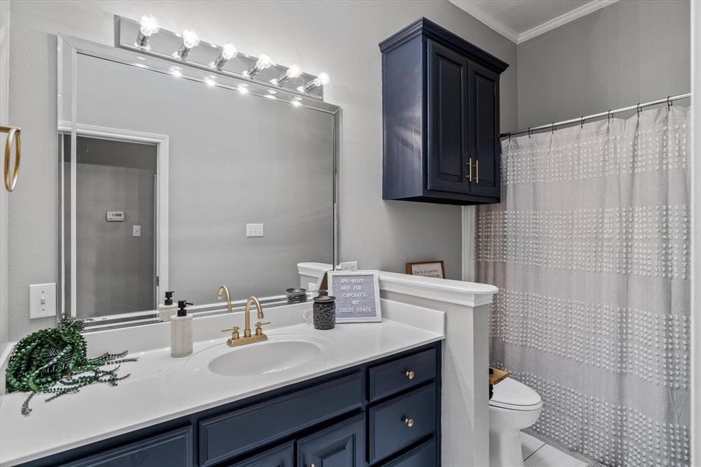 1807 Mill Creek Road Canton, TX 75103 - Photo 24 of 33 a bathroom with a sink a toilet and mirror