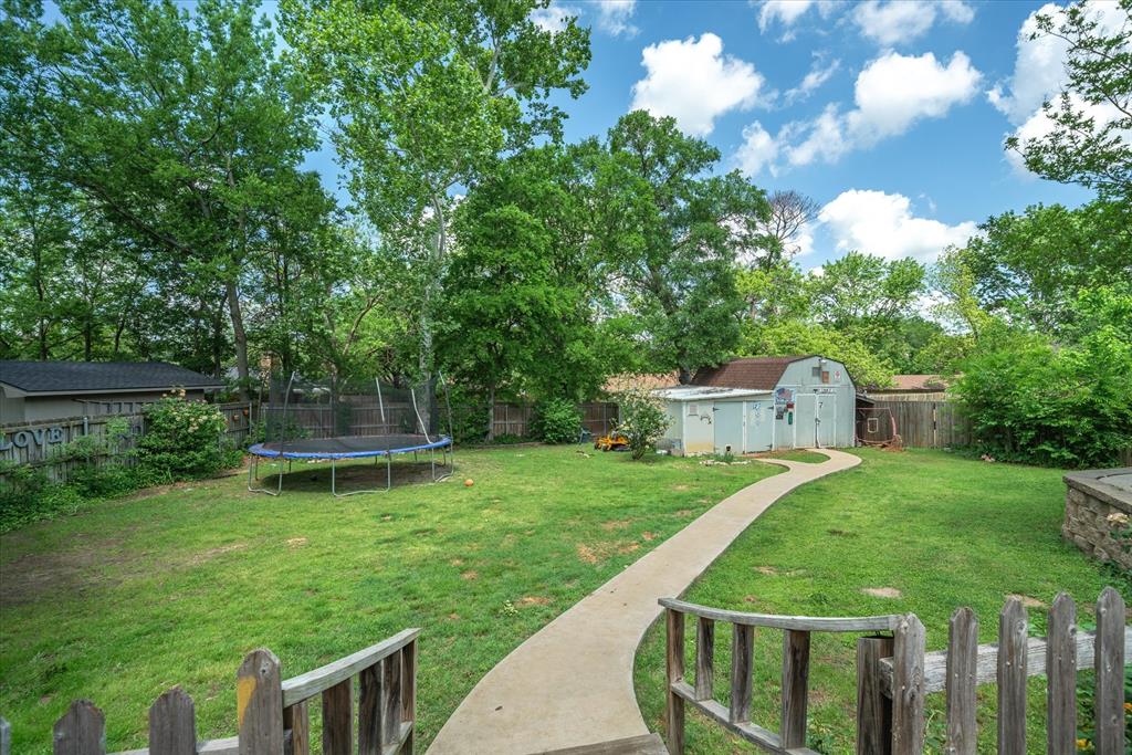 1807 Mill Creek Road Canton, TX 75103 - Photo 31 of 33 a view of a chair and table and garden in the back yard