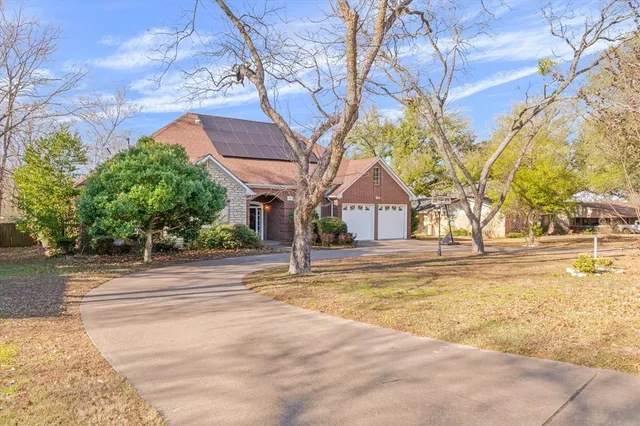 a view of road with large trees