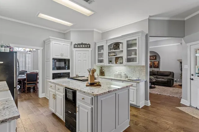 a view of living room with granite countertop furniture and fireplace
