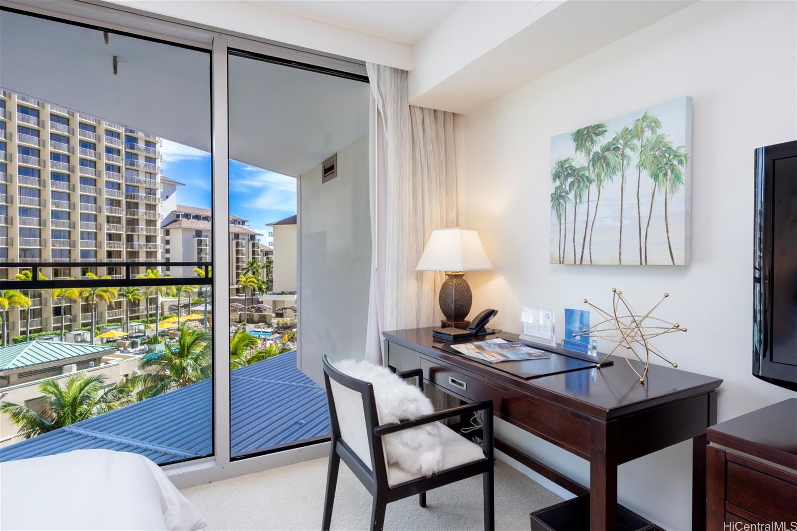 223 Saratoga Road, Unit 810 Honolulu, HI 96815 - Photo 2 of 24 a dining room with furniture and wooden floor