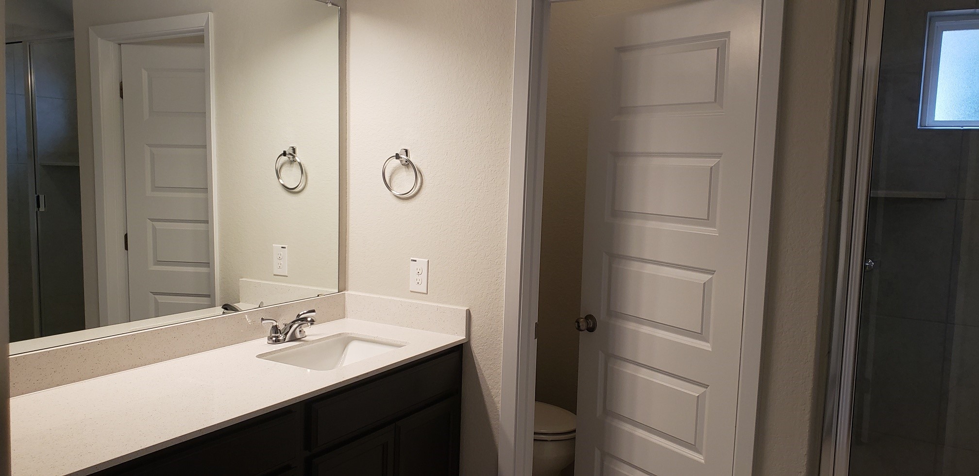 5612 Respinto Drive Austin, TX 78747 - Photo 15 of 23 a bathroom with a sink a mirror and a toilet