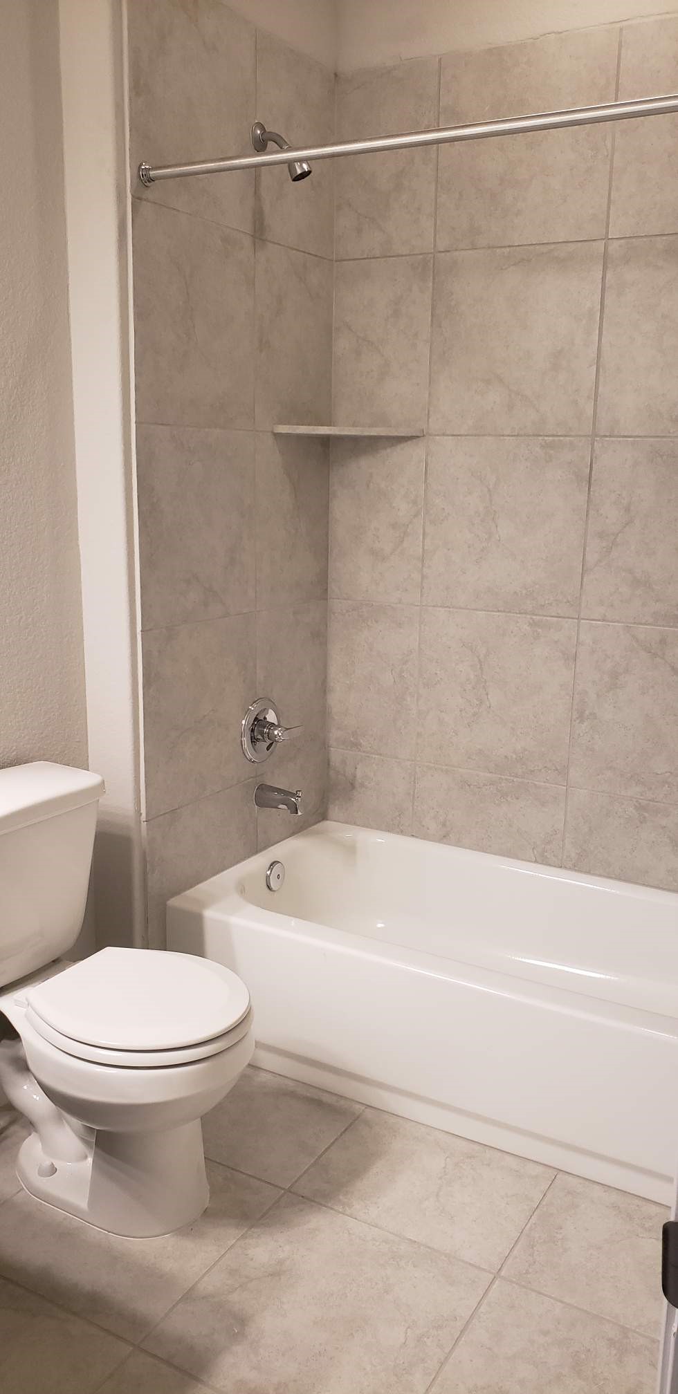 5612 Respinto Drive Austin, TX 78747 - Photo 20 of 23 a white toilet sitting next to a bath tub and a shower