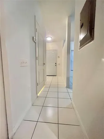 a bathroom with a glass shower door and a bathtub