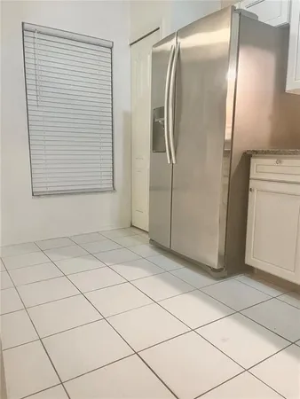 a bathroom with a shower and a mirror