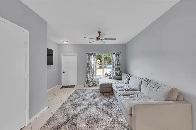 a living room with furniture and a window