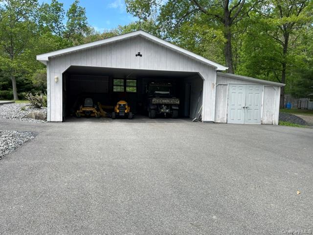 100 Decker Road, Unit 2 Wallkill, NY 12589 - Photo 4 of 23 a view of a house with a yard and garage