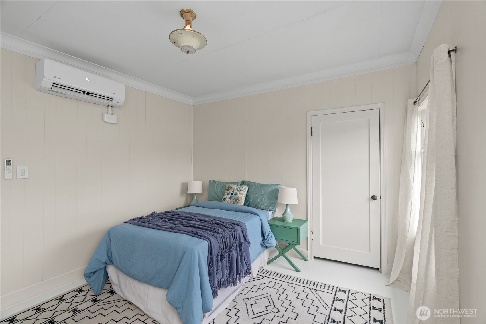 515 5th Street Hoquiam, WA 98550 - Photo 21 of 34 a bedroom with a bed and a window