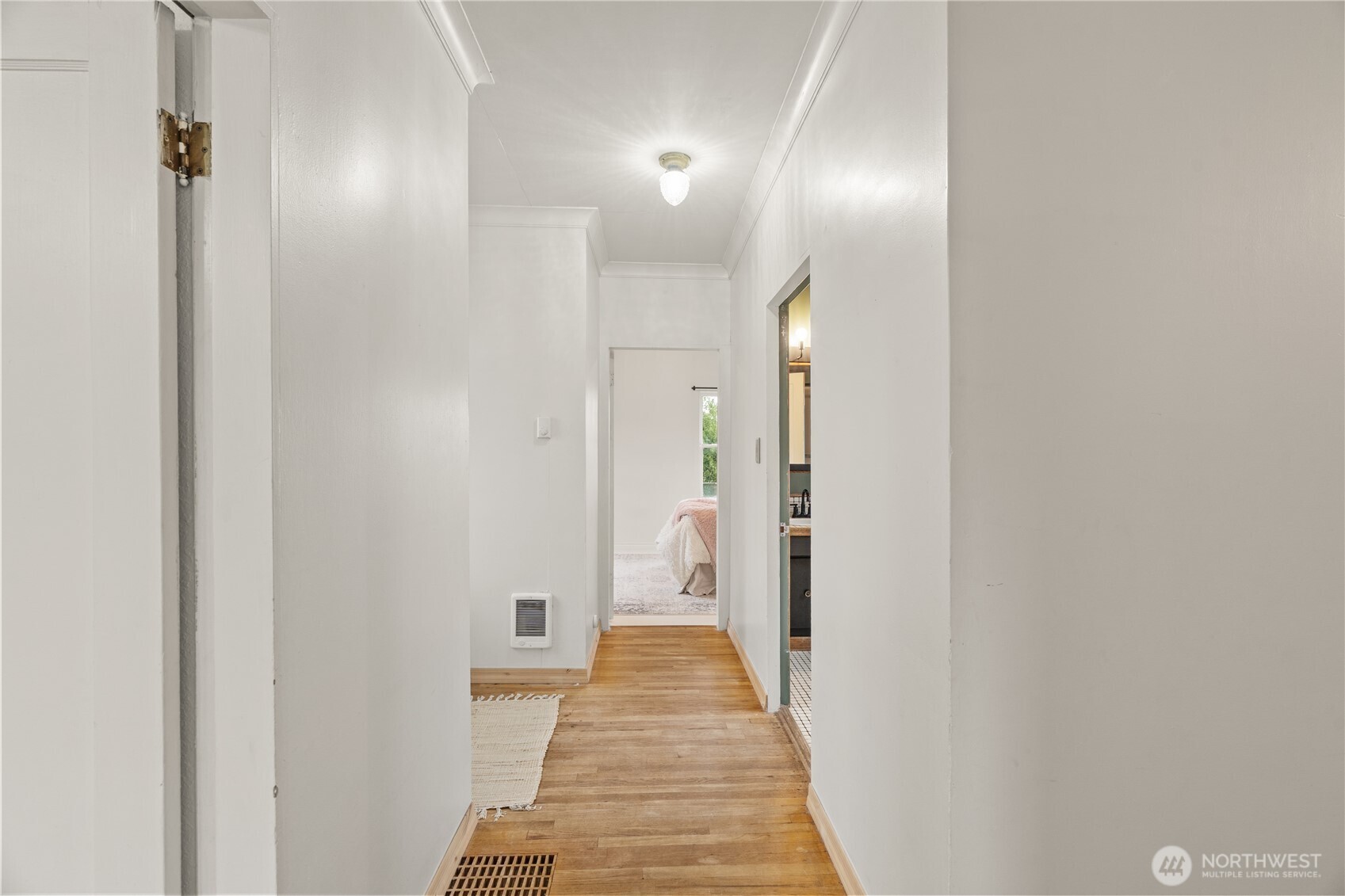 515 5th Street Hoquiam, WA 98550 - Photo 22 of 34 a view of a hallway with wooden floor