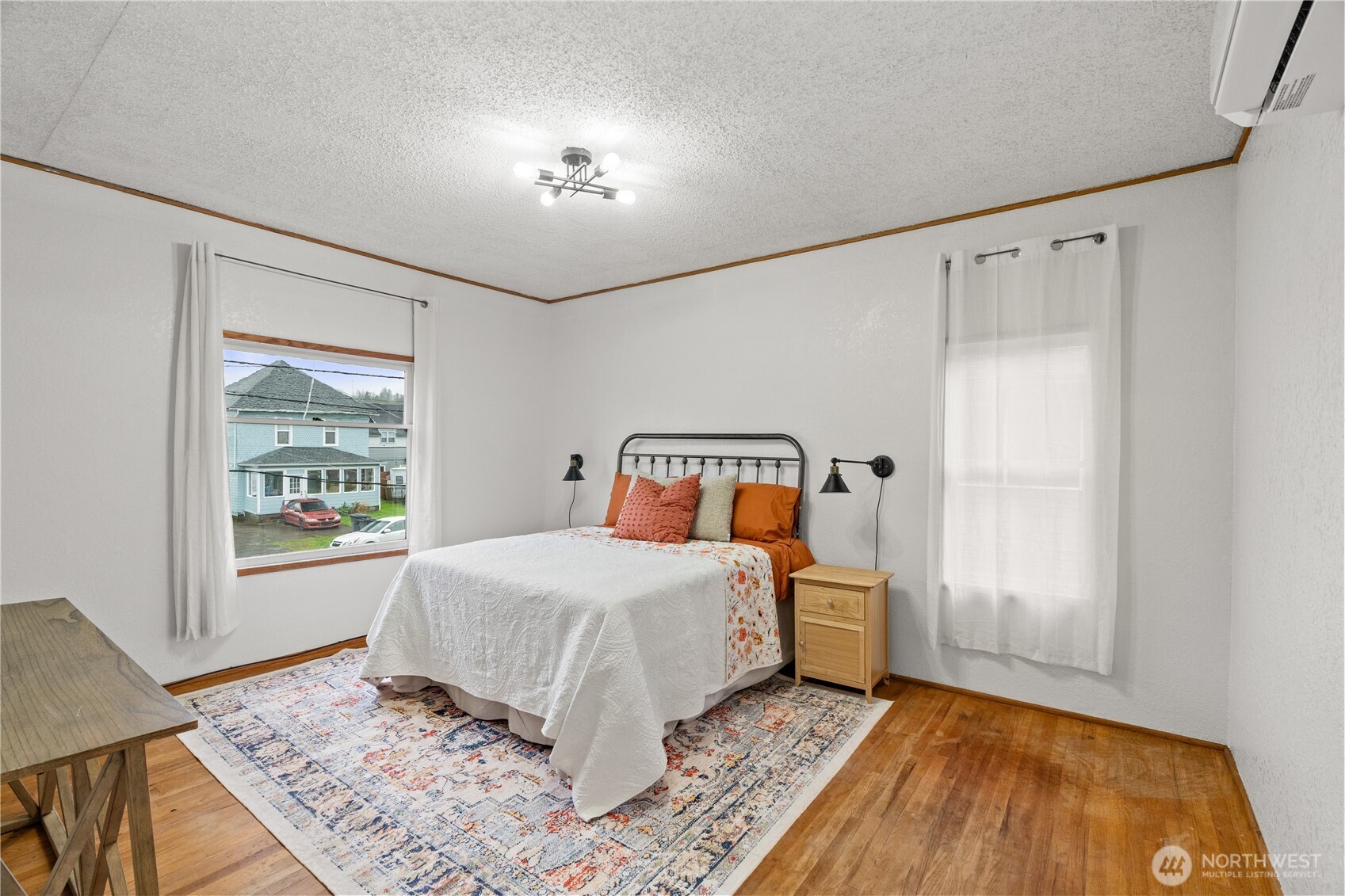 515 5th Street Hoquiam, WA 98550 - Photo 23 of 34 a bedroom with a bed and a window