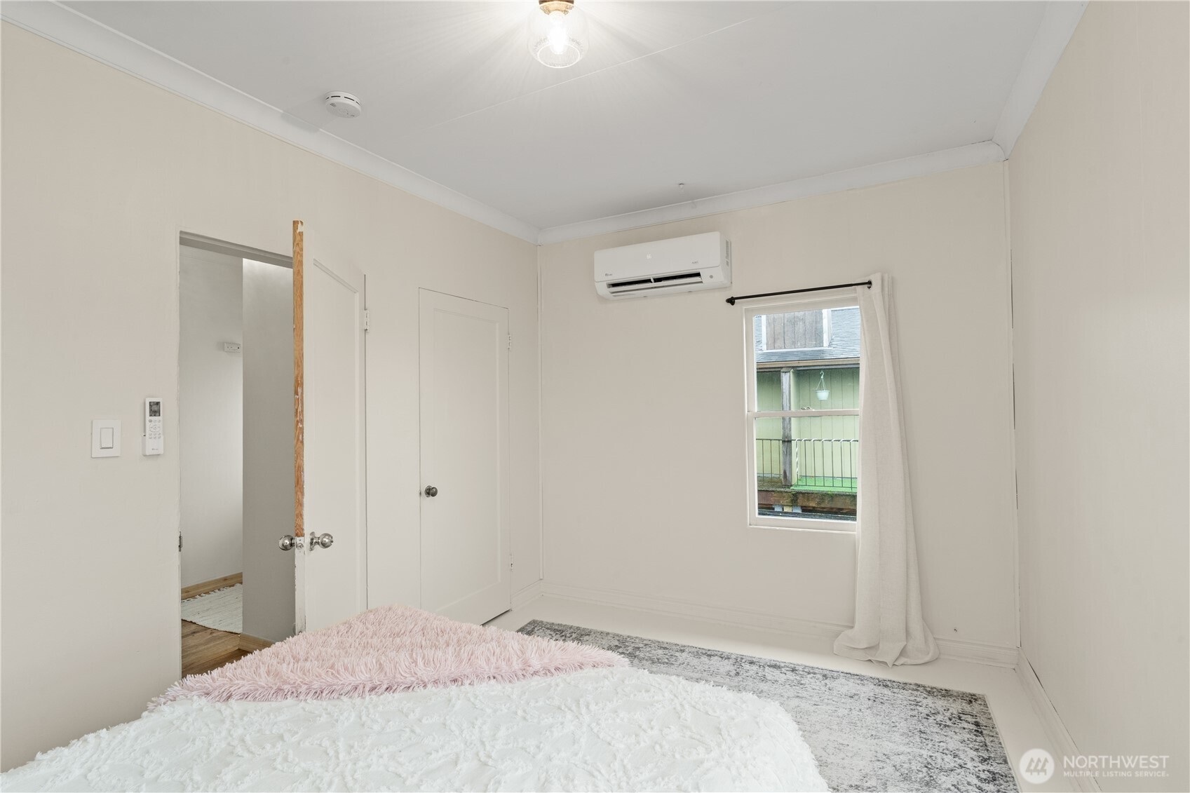 515 5th Street Hoquiam, WA 98550 - Photo 29 of 34 a bedroom with a bed and a window