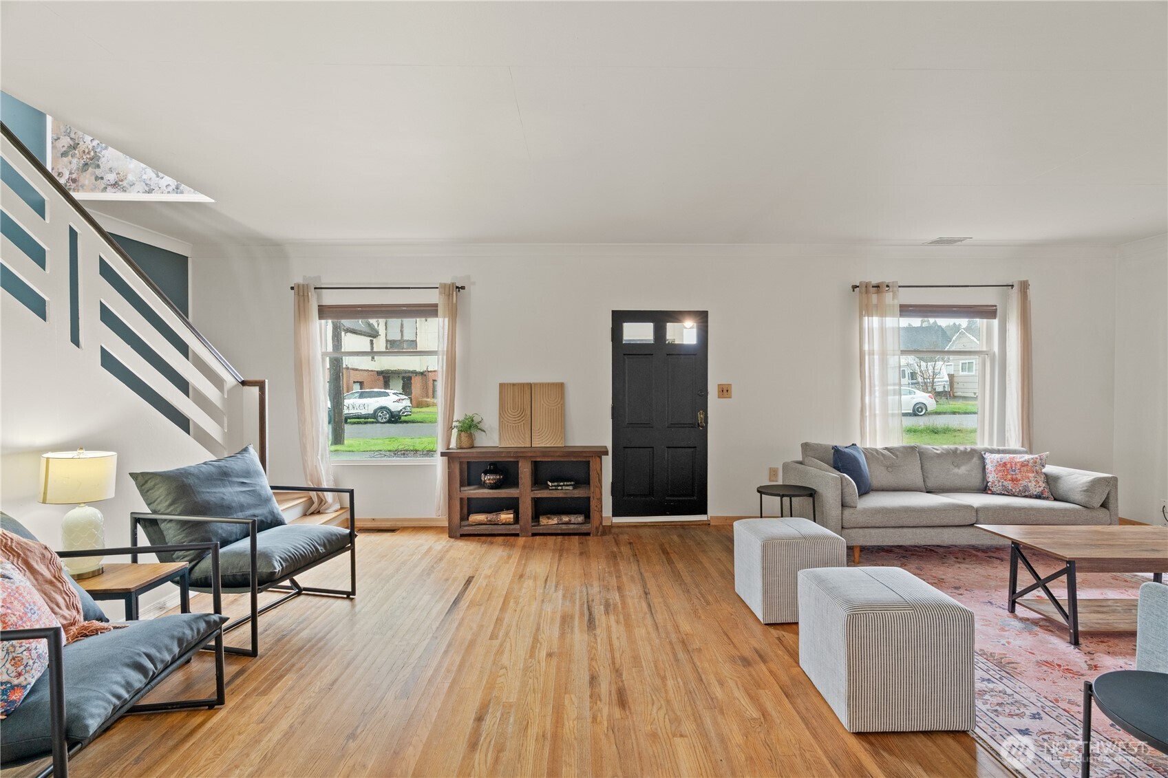 515 5th Street Hoquiam, WA 98550 - Photo 5 of 34 a living room with furniture and a wooden floor