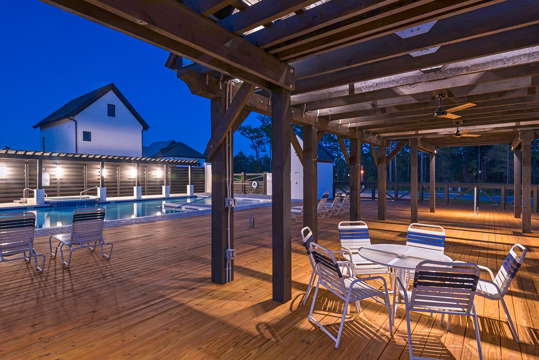 285 Ridgewalk Circle Santa Rosa Beach, FL 32459 - Photo 25 of 33 a view of pool with lawn chairs and wooden floor