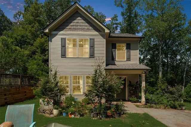 a front view of a house with garden