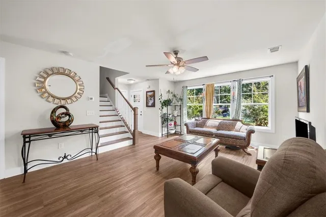 a living room with furniture and a large window