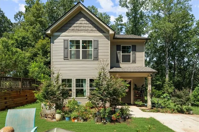 a front view of a house with garden