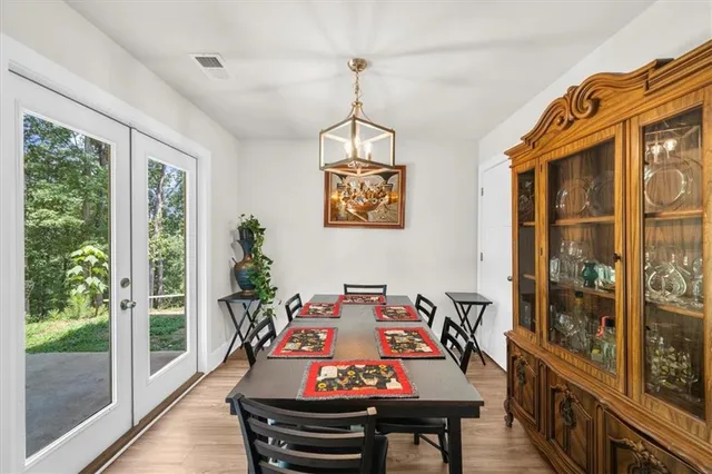 a view of a dining room with furniture window and outside view