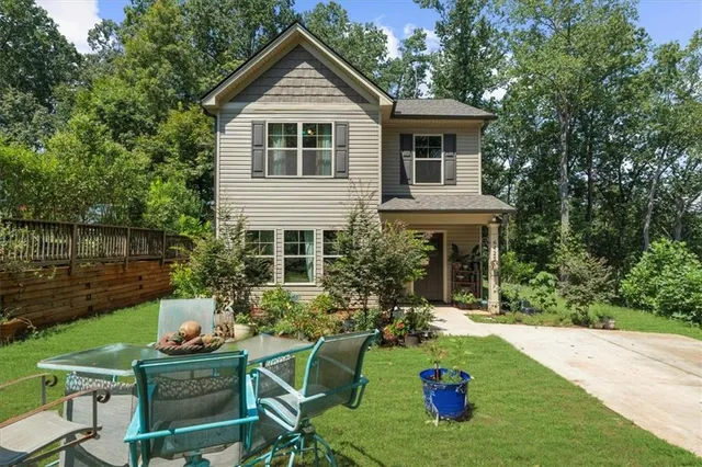 a front view of a house with garden