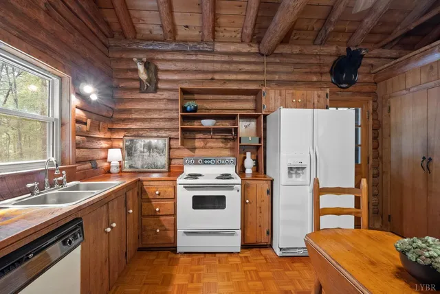 a kitchen with a refrigerator and a sink