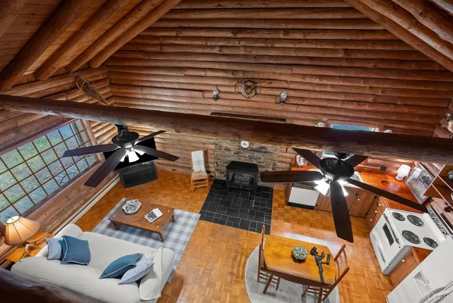 a view of a backyard with seating space