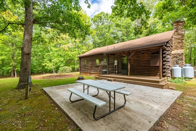 a view of backyard with a patio