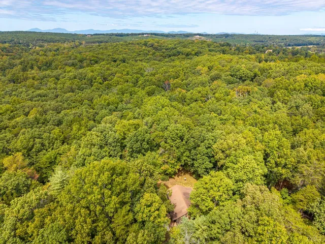 a view of a field with an ocean view
