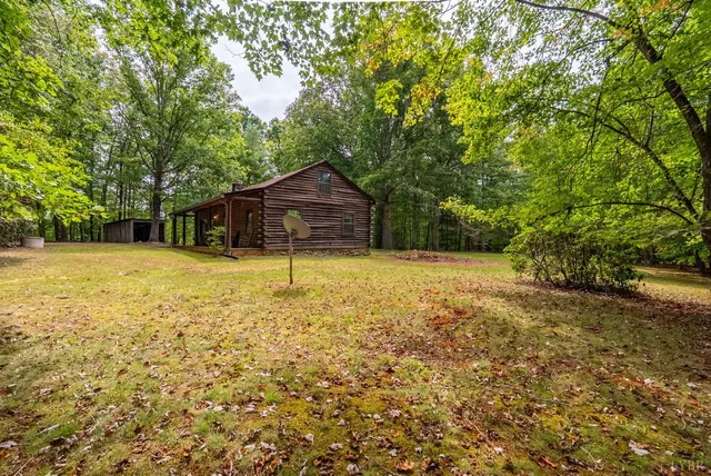 a house view with swimming pool in front of it