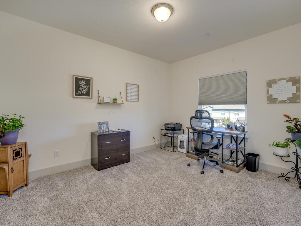 2257 Local Rebel Loop Leander, TX 78641 - Photo 21 of 26 a room with furniture and a window