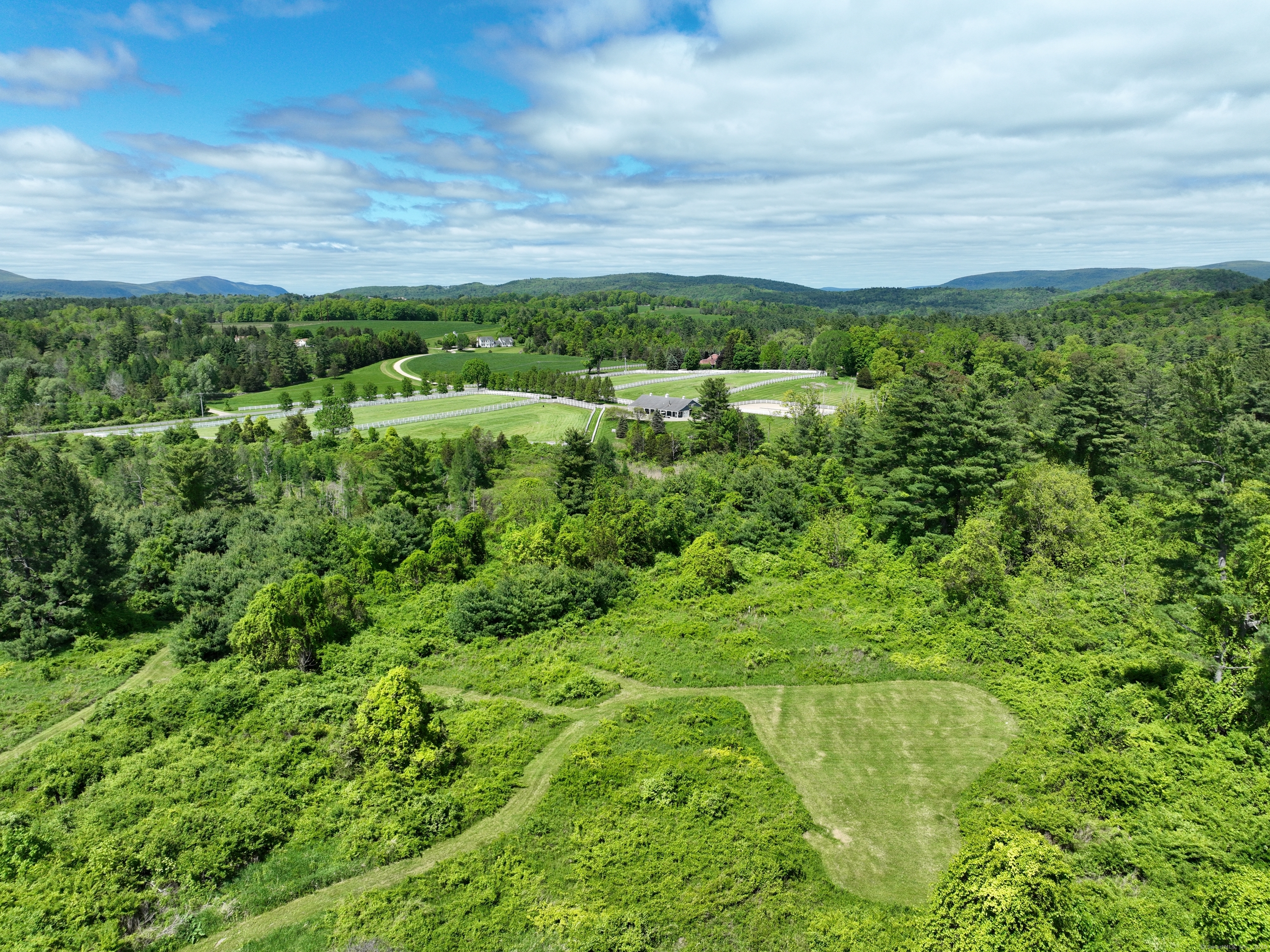10 Red Mountain Road Salisbury, CT 06039 - Photo 2 of 7 a view of a lush green field
