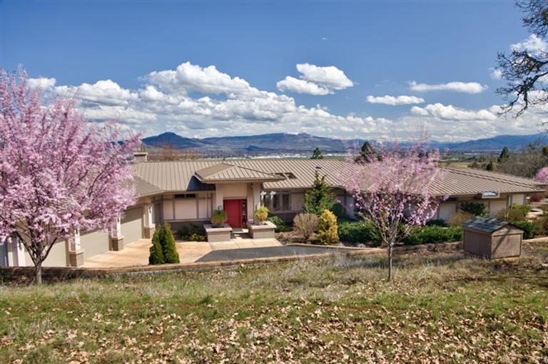 3346 Old Military Road Central Point, OR 97502 - Photo 1 of 24 a view of a house with a yard and potted plants