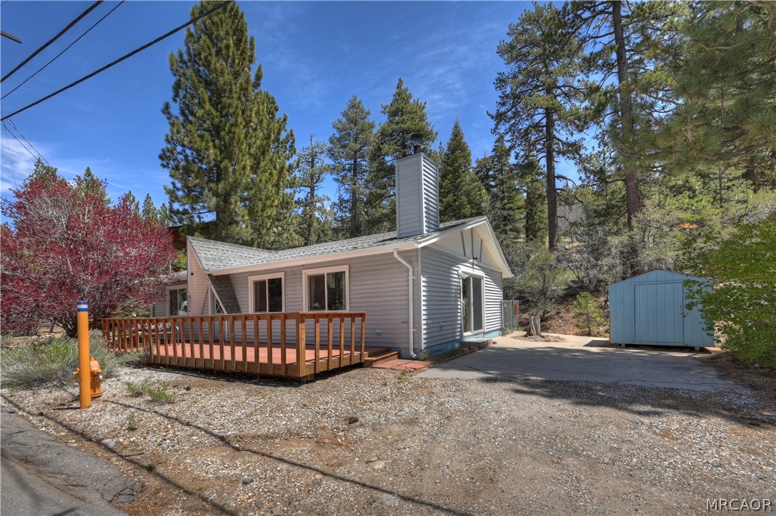 1099 Canyon Road Fawnskin, CA 92333 - Photo 32 of 39 front view of a house with wooden fence