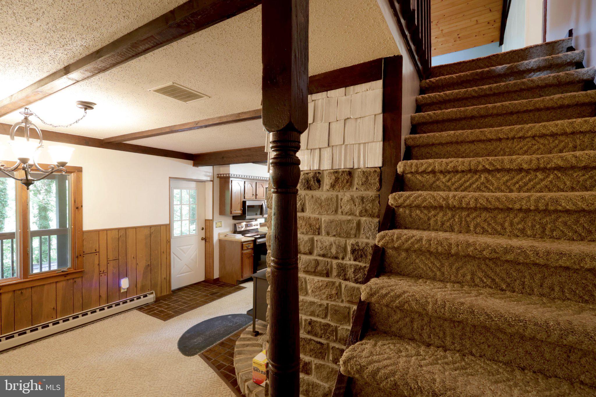 313 Jack Straw Road Julian, PA 16844 - Photo 47 of 69 Charming entryway with cozy staircase.