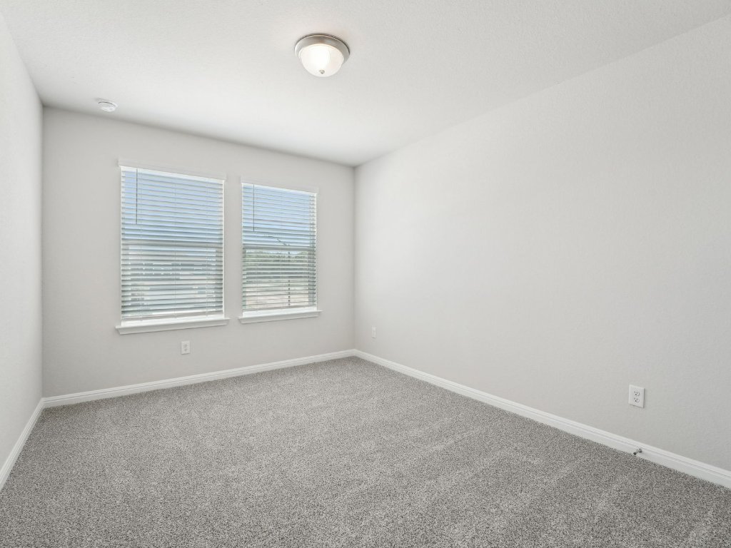 165 Calcite Road, Unit 2 Kyle, TX 78640 - Photo 10 of 14 an empty room with a window