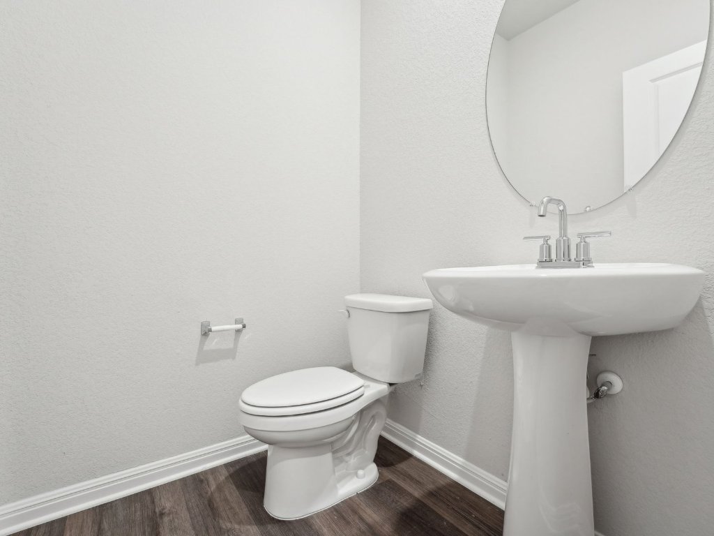 165 Calcite Road, Unit 2 Kyle, TX 78640 - Photo 4 of 14 a bathroom with a sink toilet and a mirror