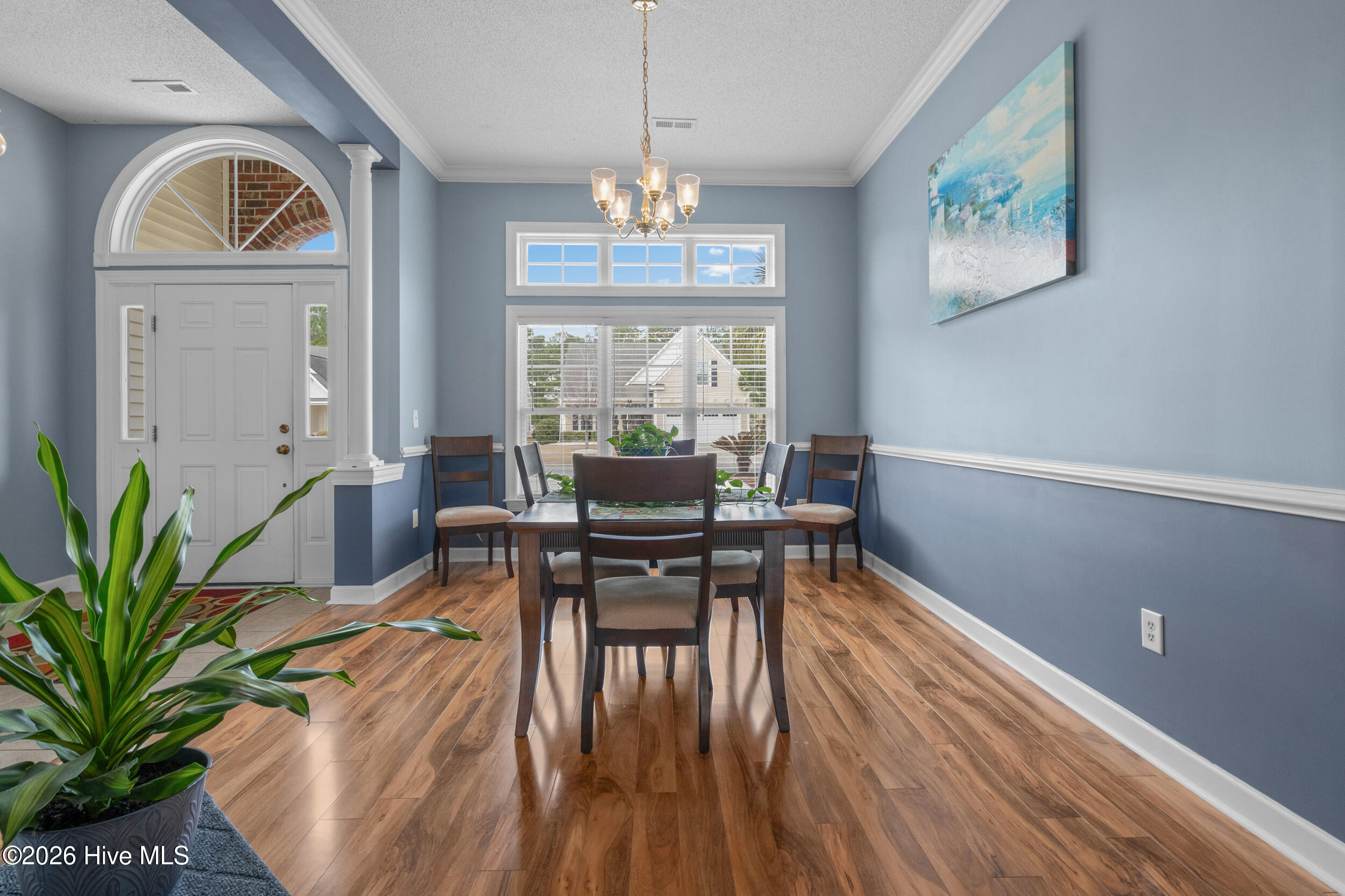 1013 Meadowlands Trail Calabash, NC 28467 - Photo 16 of 41 This formal dining area offers a dedicated space for special occasions and provides a separate area for meals, distinct from the hustle and bustle of daily life.