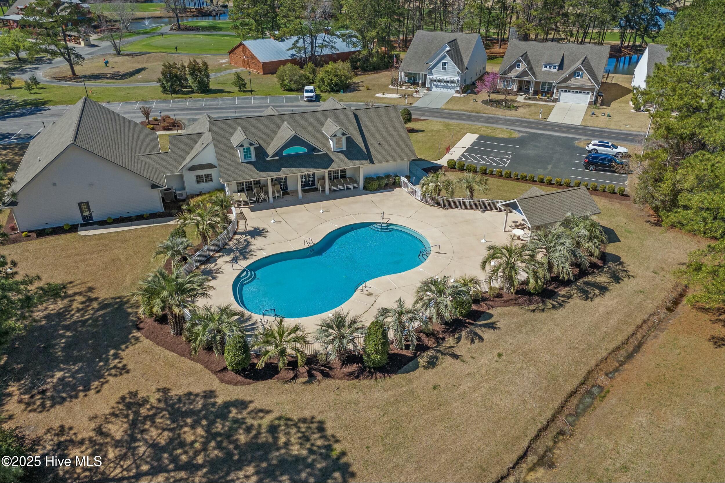 1013 Meadowlands Trail Calabash, NC 28467 - Photo 32 of 41 Meadowlands HOA amenities include a clubhouse, community outdoor pool, and fitness center.