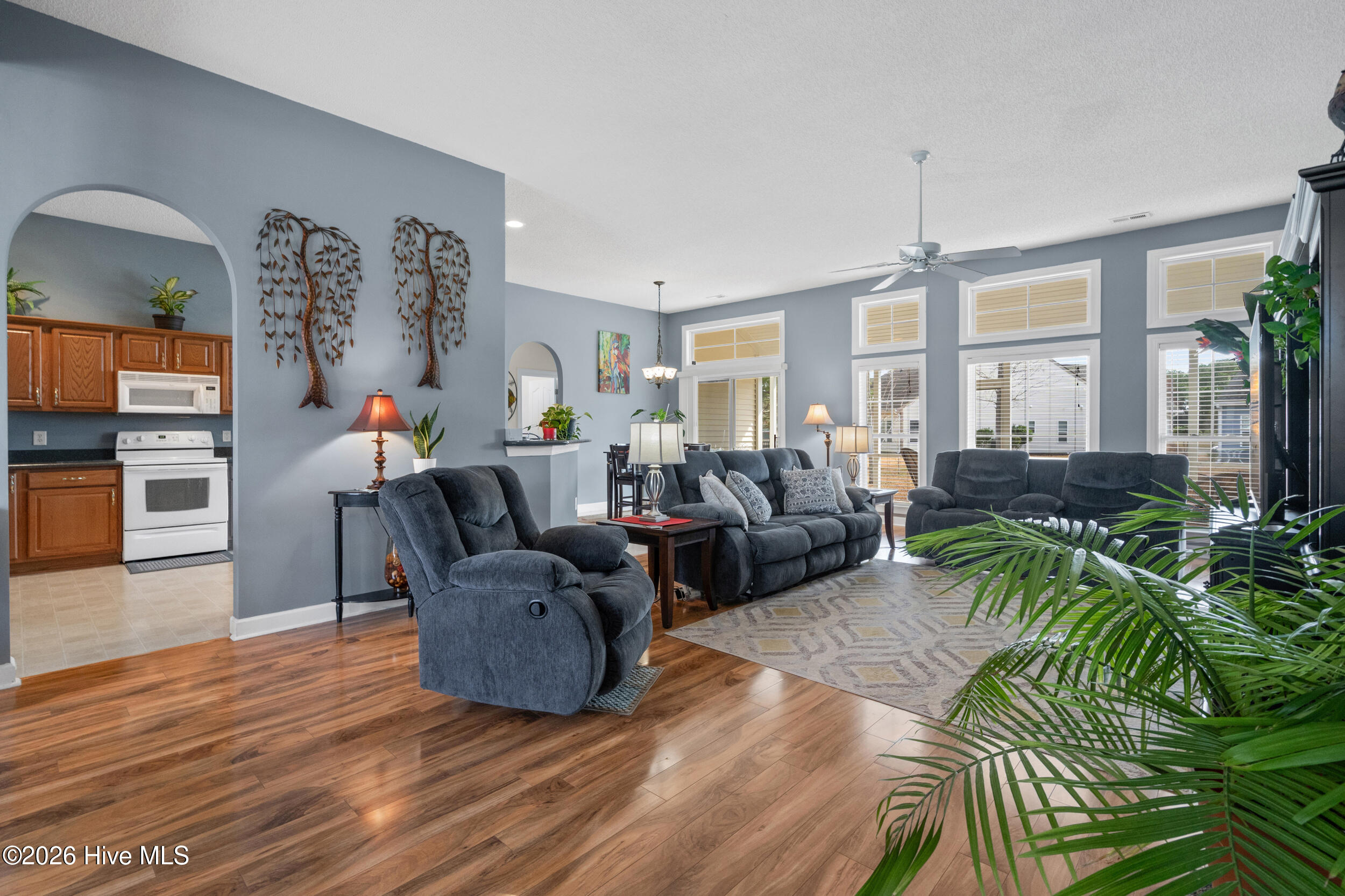 1013 Meadowlands Trail Calabash, NC 28467 - Photo 8 of 41 The living area features high ceilings and opens to the formal dining area and large eat-in kitchen.