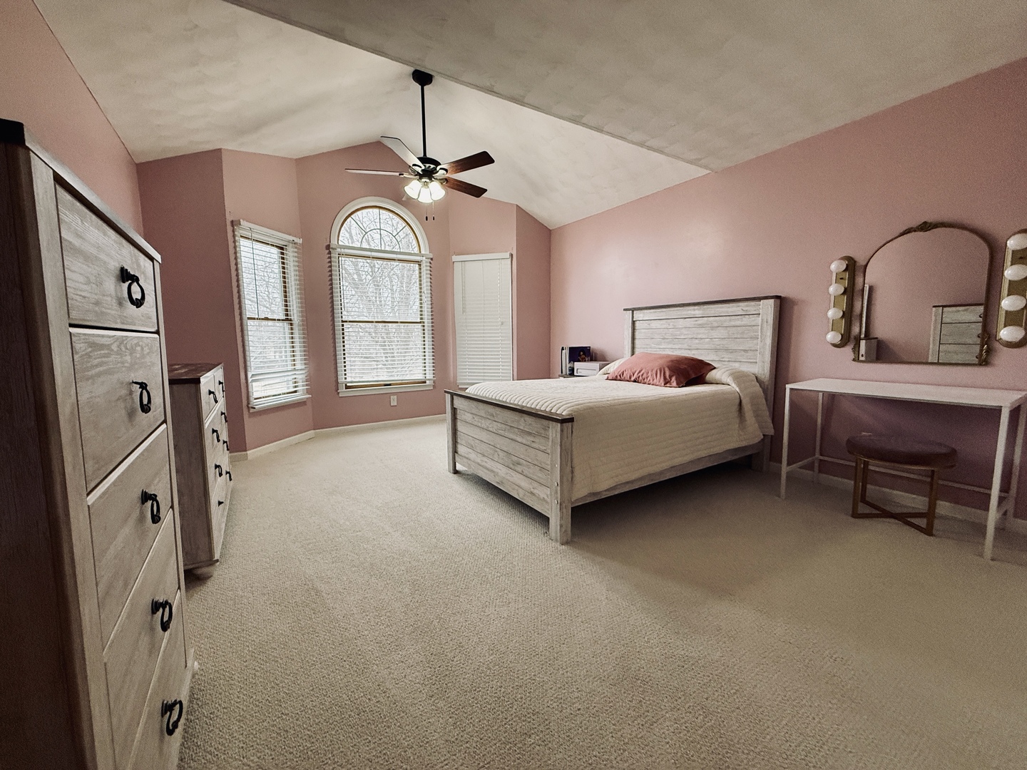 10151 East Hickory Ridge Drive Rochelle, IL 61068 - Photo 19 of 31 a spacious bedroom with a bed a chandelier and dresser