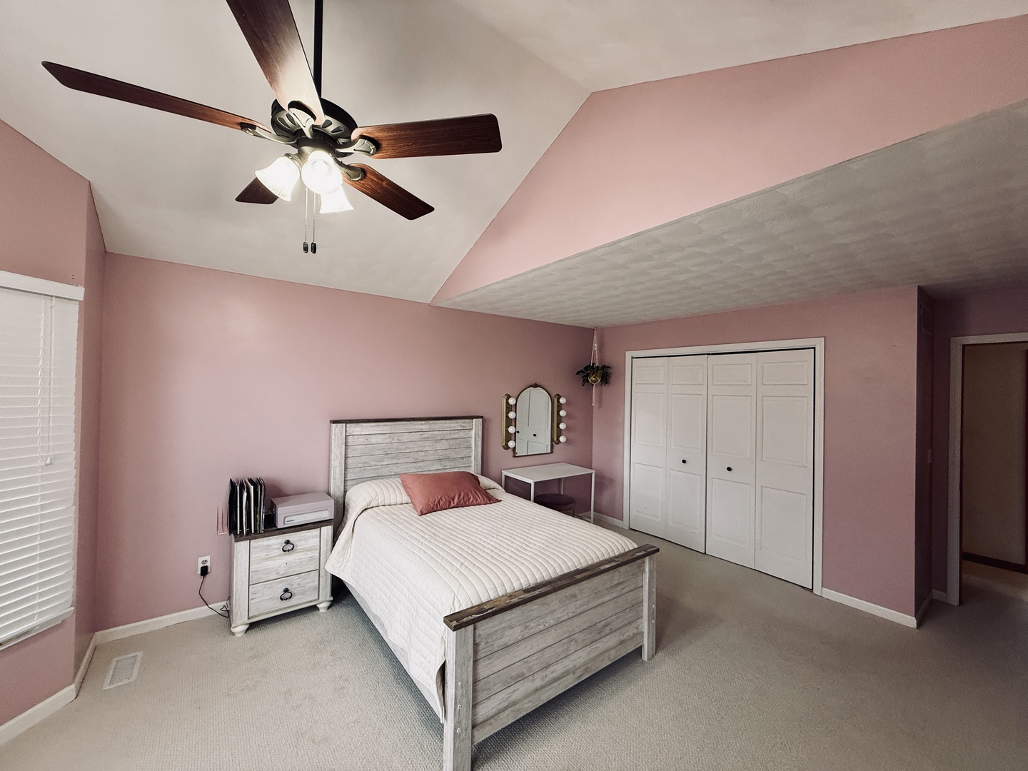 10151 East Hickory Ridge Drive Rochelle, IL 61068 - Photo 21 of 31 a bedroom with a bed and a chandelier