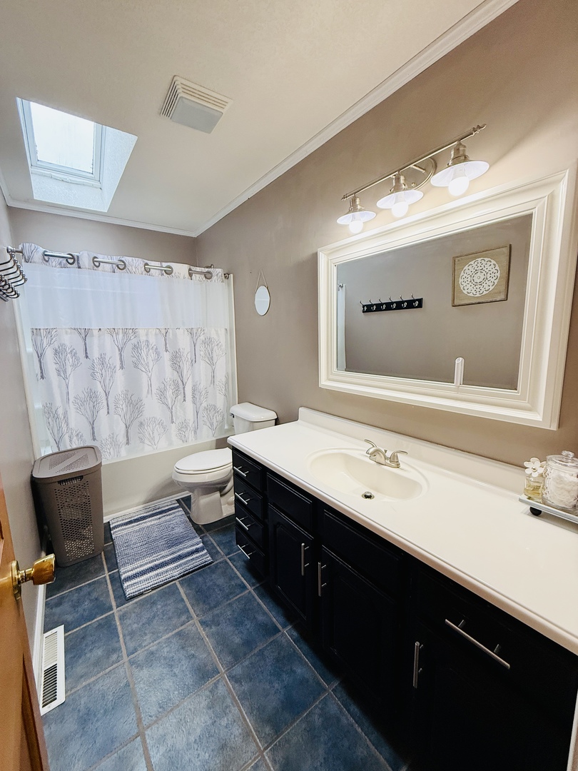 10151 East Hickory Ridge Drive Rochelle, IL 61068 - Photo 24 of 31 a bathroom with a double vanity sink mirror and bathtub