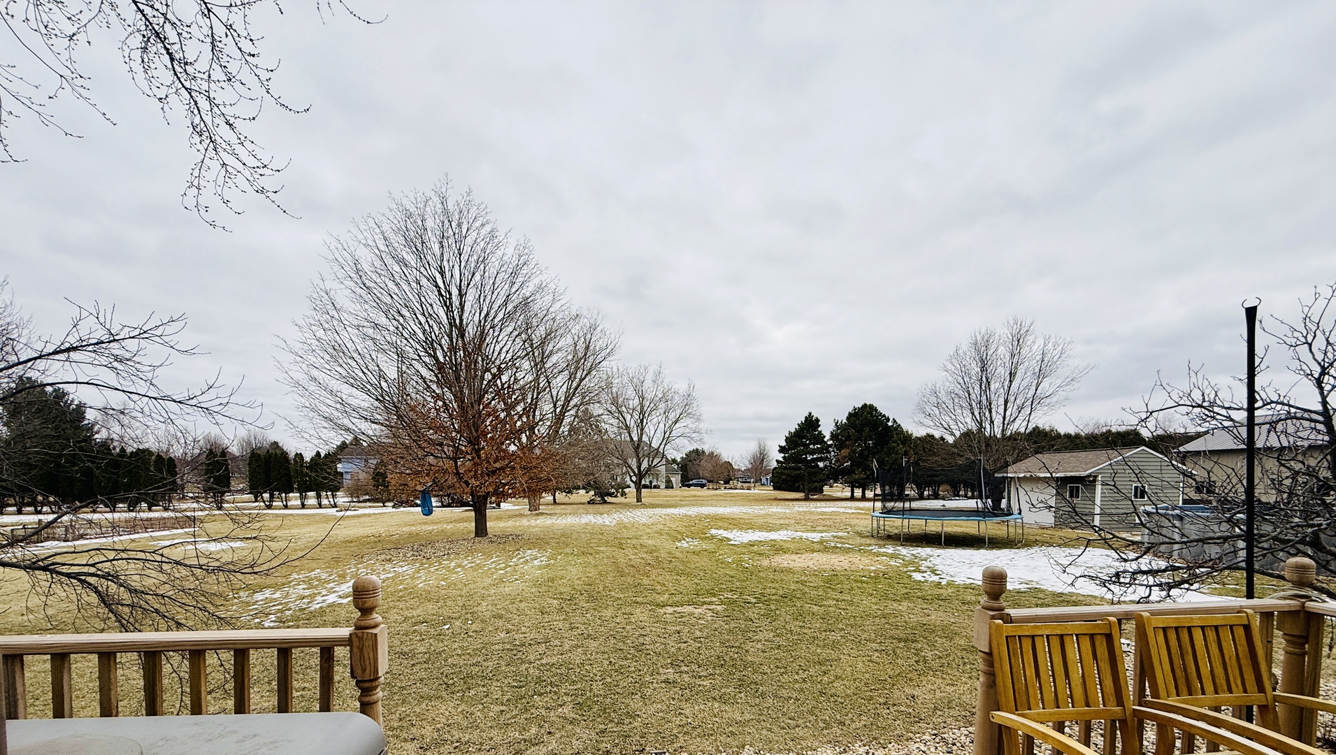 10151 East Hickory Ridge Drive Rochelle, IL 61068 - Photo 31 of 31 a view of swimming pool with outdoor seating and trees in the background